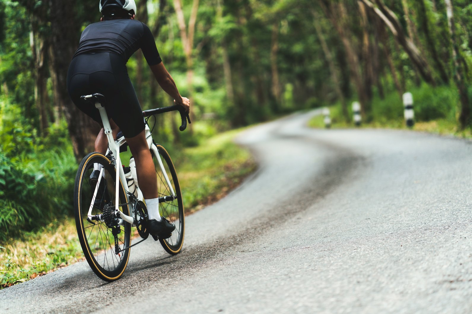 Cyclist He was cycling uphill climb in the woods.